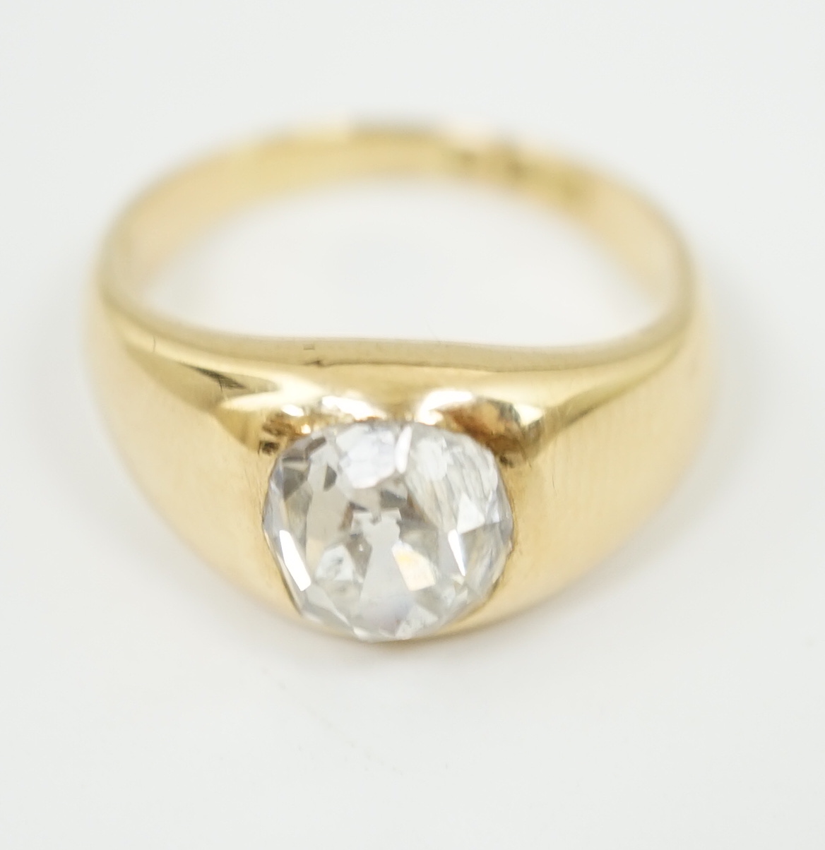 A George V 18ct gold and solitaire diamond gypsy set ring
